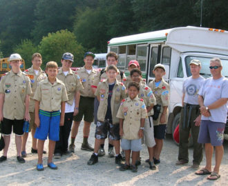 scouts troop poses in uniform as they get off the bus Downriver Canoe Company Shenandoah Valley River